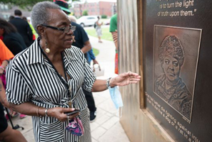 Ephelia Thomas, long-time resident of the Ida B. Wells Homes admires the Ida B. Wells Monument in Bronzeville on June 30, 2021, photo by Colin Boyle, Block Club Chicago