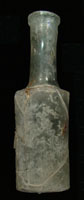 Figure�9. The rare Tabasco bottle recovered during archaeological excavations of the Boston Saloon is shown here, with a�closeup�view�of the�base�mark. Photos by Ronald�M. James.