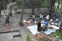 Excavations within Cabin W-12 at Kingsley Plantation, tabby block pier from Cabin W-13 in left foreground.