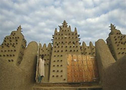 A Malian walks out of the Great Mosque in Djenne, Mali in this August 10, 2003, file photo. Reuters file photo.
